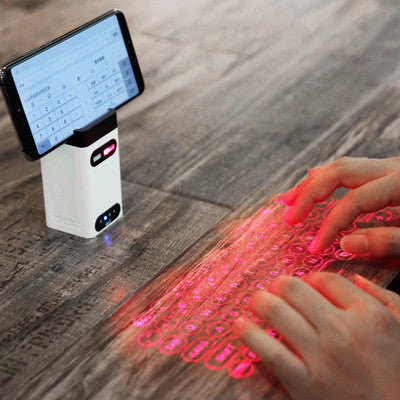 Virtual laser projection keyboard projecting QWERTY layout onto flat surface with Bluetooth connectivity and mouse function